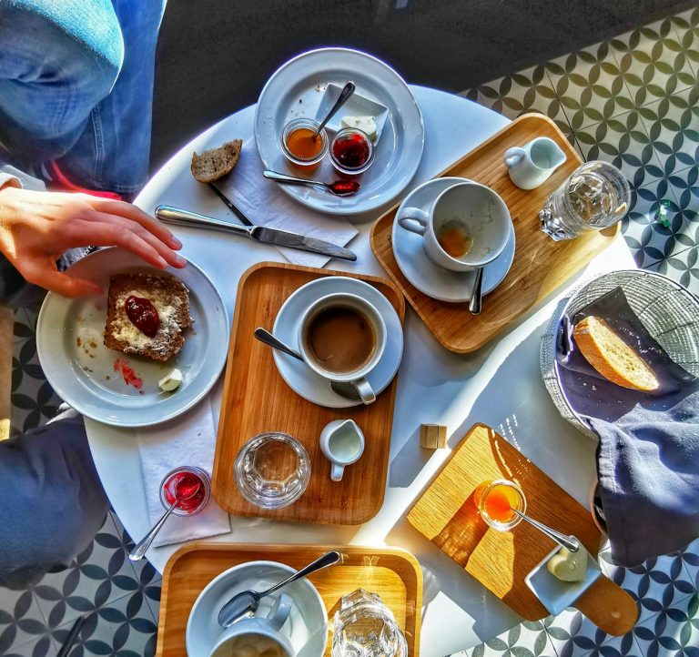 A breakfast scene depicting people coming together in love and friendship.